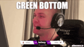 a man wearing headphones with the words green bottom on the bottom
