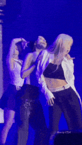 a group of women are dancing on a stage with the name breeze1724 on the bottom right