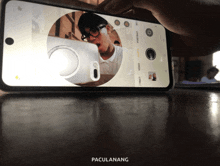 a phone that has the word paculanang on the bottom left
