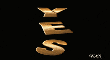 a black background with gold letters that spell out the word yes