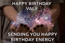 a person is holding a galaxy in their hands and sending you a happy birthday energy .