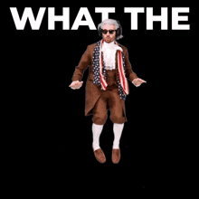 a man in a suit is standing on a strawberry with the words what the helly written below him