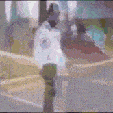 a blurry picture of a person walking on a street