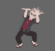 a man in a red shirt and black jacket is kneeling down with his hands on his head