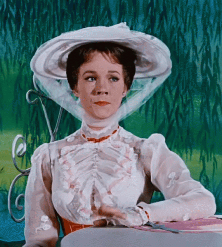 Mary Poppins tapping her fingers to hurry things up
