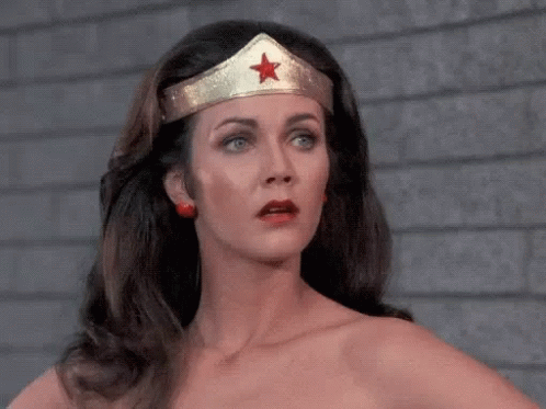 Lynda Carter as Wonder Woman, head and shoulders, wearing that crown, with eyeroll and exasperated sigh