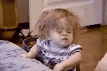Stressed, drained, tired gif of a baby