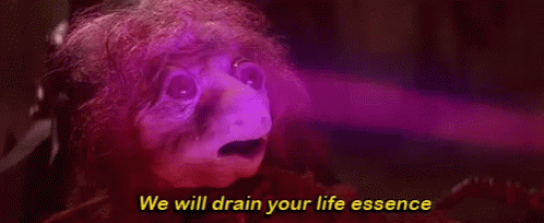 GIF from the movie The Dark Crystal. A gelfling's face shrivels as its life force is sucked out.