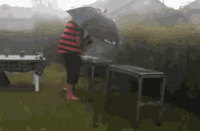 Bbq Grill In The Rain GIF - BackyardGrill Rain Umbrella GIFs