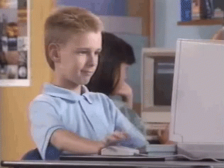 Gif of a kid at a computer, giving a thumbs up and nodding.