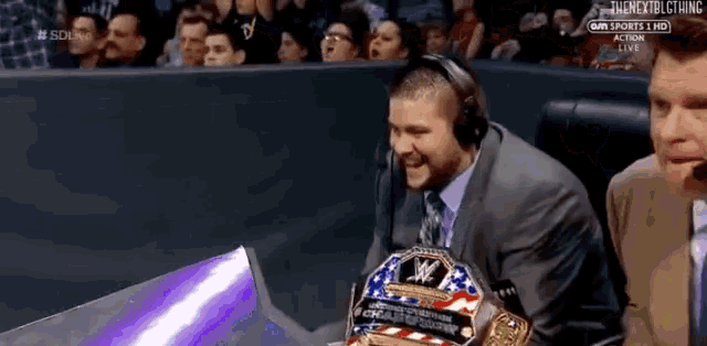 Champ KO laughing at announce table