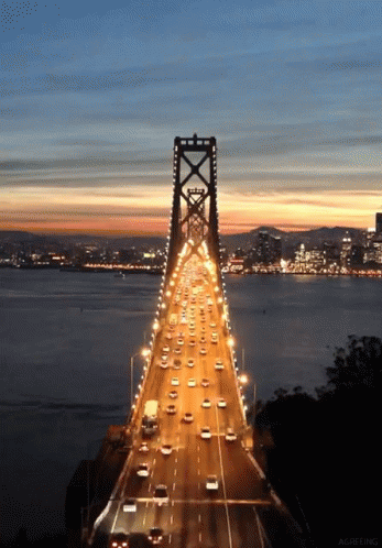 Bay Bridge at dusk, traffic moving rapidly