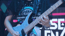 a person wearing a shirt that says heaven on it