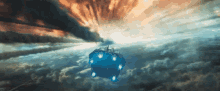 a blue cube with lights on it is flying through a cloudy sky