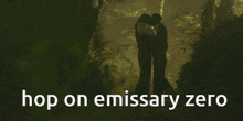 a couple kissing in a dark forest with the words hop on emissary zero below them