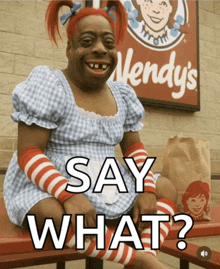 a wendy 's sign is behind a woman in a wendy 's dress