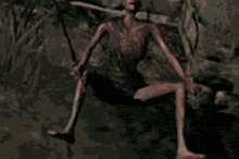 a strange creature is holding a sword in a dark forest