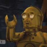 a close up of a lego star wars character , c3po , waving .