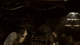 a couple of cartoon animals are standing next to each other in a dark room .