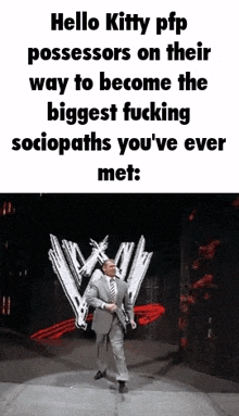 a man in a suit and tie is walking on a stage in front of a w logo .
