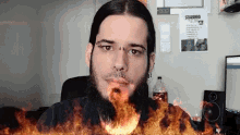 a man with a beard and a poster that says stabbed on it