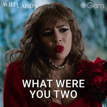 a woman in a red dress is making a face and says " what were you two "