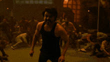 a man with a beard is walking down a street screaming