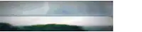 a blurred image of a body of water with a green island in the distance .