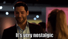 a man in a suit is smiling and says it 's very nostalgic .