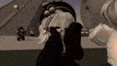 a girl with white hair wearing a black hat with pom poms on it