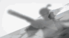 a black and white photo of a person standing on a ledge .
