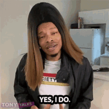 a man in a wig says yes i do in a kitchen