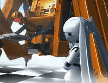 a robot is standing in front of a machine that has the letters eee on it