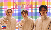 three men standing in front of a colorful plaid background with the word salamat written on it
