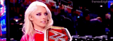a woman is holding a trophy that says thank you on it