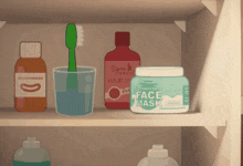 a jar of face mask sits on a shelf next to a bottle of mouthwash and a toothbrush