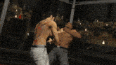a man with a dragon tattoo on his back is fighting another man in a cage