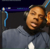 a man wearing headphones with a screen behind him that says yo speed i love your streams can you say hi hector