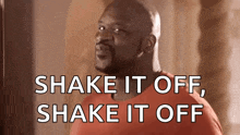 a man in a red shirt says shake it off shake it off