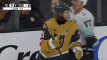 a hockey player wearing a jersey with the letter a on the front