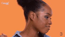 a woman 's face is shown with the number 3 below her