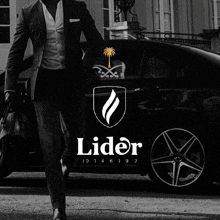 a black and white photo of a man in a suit standing next to a car with the word lider on it