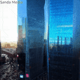 a picture of a city with the words sanda media written on the bottom
