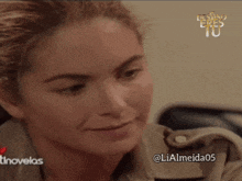 a close up of a woman 's face with the hashtag @ lialmeida05