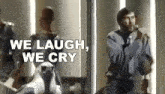 a man is singing into a microphone with the words `` we laugh , we cry '' written on the bottom .