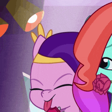 a pink pony with a crown on her head is sticking out its tongue