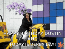 a woman in a purple hat is riding a yellow horse .