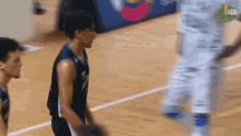a basketball player with the number 1 on his jersey is standing on the court
