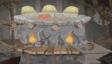 a large pot of food is sitting on top of a wooden table in a castle .