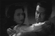 a black and white photo of a man and woman hugging with the caption idlesuperstar